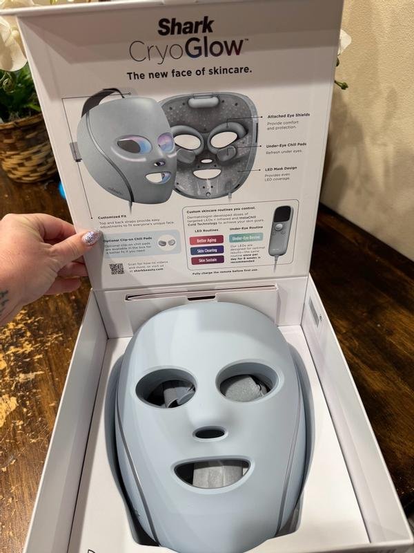 Shark CryoGlow mask unboxed on wood table